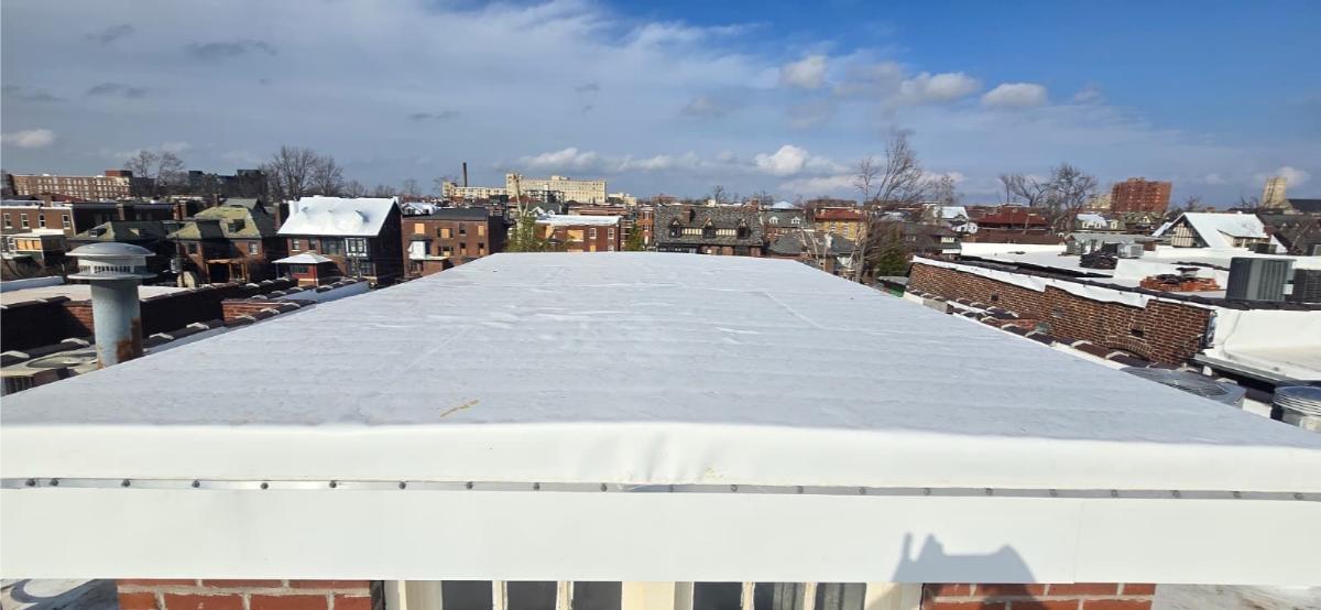 TPO membrane install in progress on a commercial flat roof