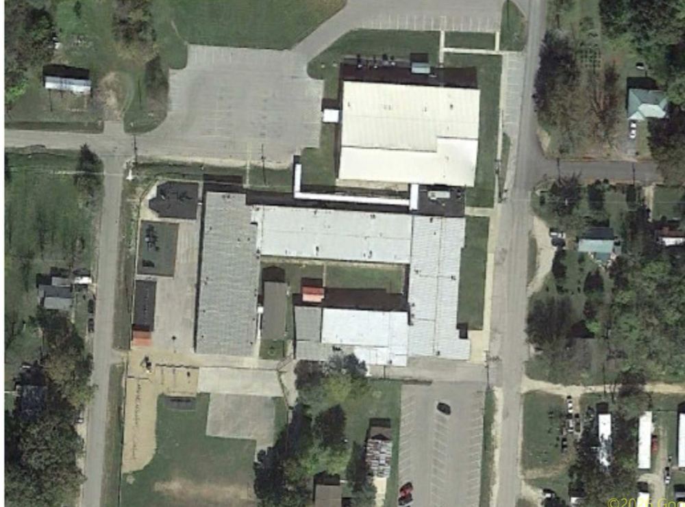 Aerial of an Amigo metal-roof commercial complex