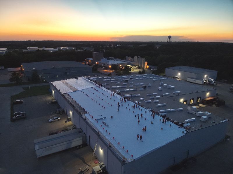 Sunset aerial of an Amigo industrial roof installation in the St. Louis metro